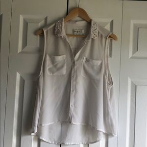 White sleeveless blouse